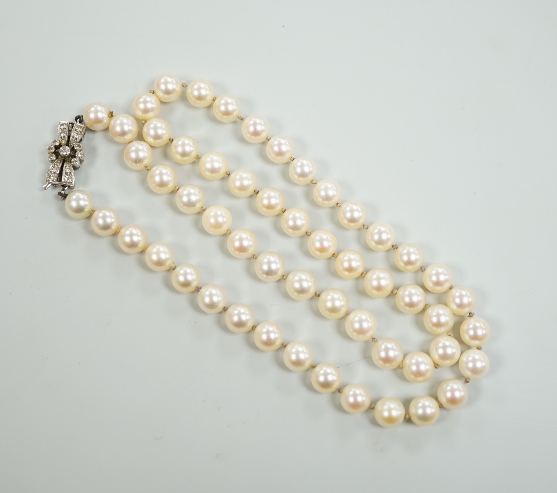 A single strand cultured pearl necklace, with diamond set 18ct white gold clasp, 48cm.